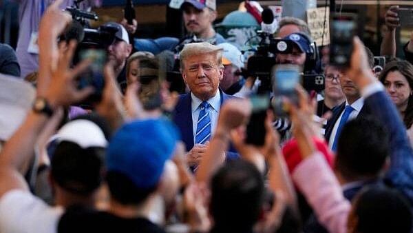 <div class="paragraphs"><p>Republican presidential candidate and former US President Donald Trump holds a campaign stop at Sanaa convenient store, in the Harlem section of New York City. </p></div>