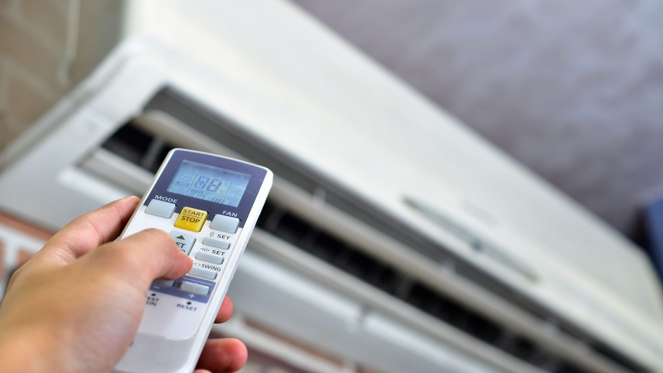 <div class="paragraphs"><p>Representative image showing a person turning on an air conditioner</p></div>