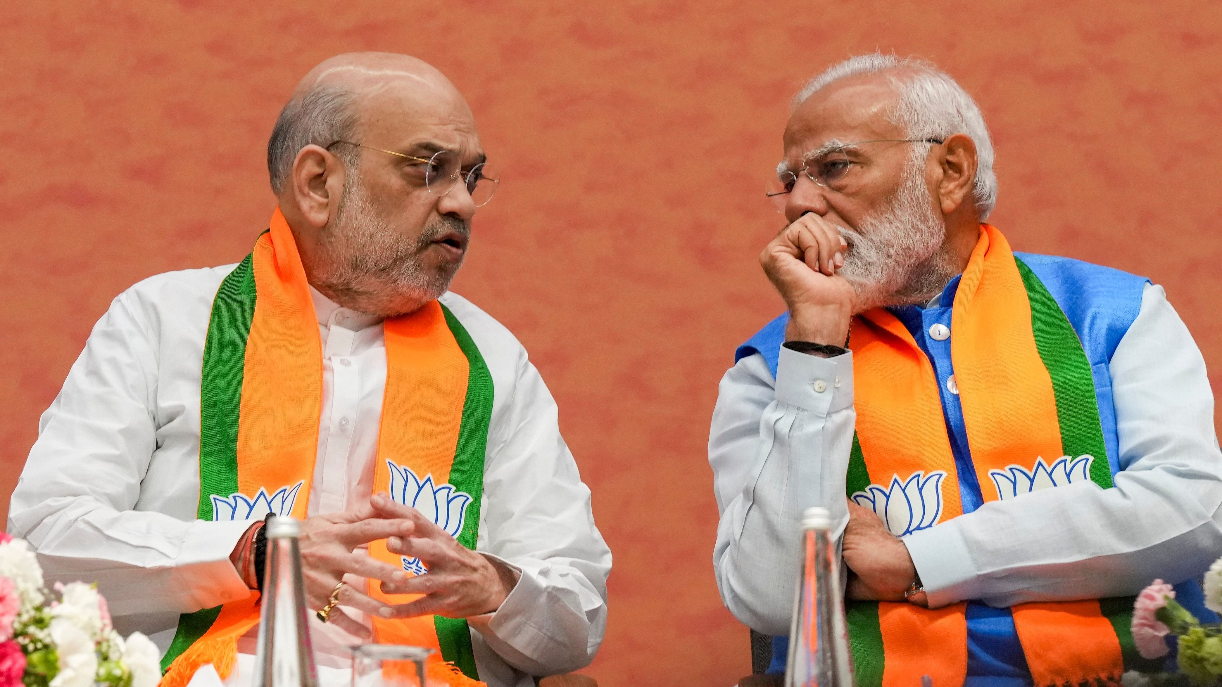 <div class="paragraphs"><p>New Delhi: Prime Minister Narendra Modi and Union Home Minister Amit Shah during the release of BJP's election manifesto Sankalp Patra for the Lok Sabha polls, at the party headquarters, in New Delhi, Sunday, April 14, 2024.</p></div>