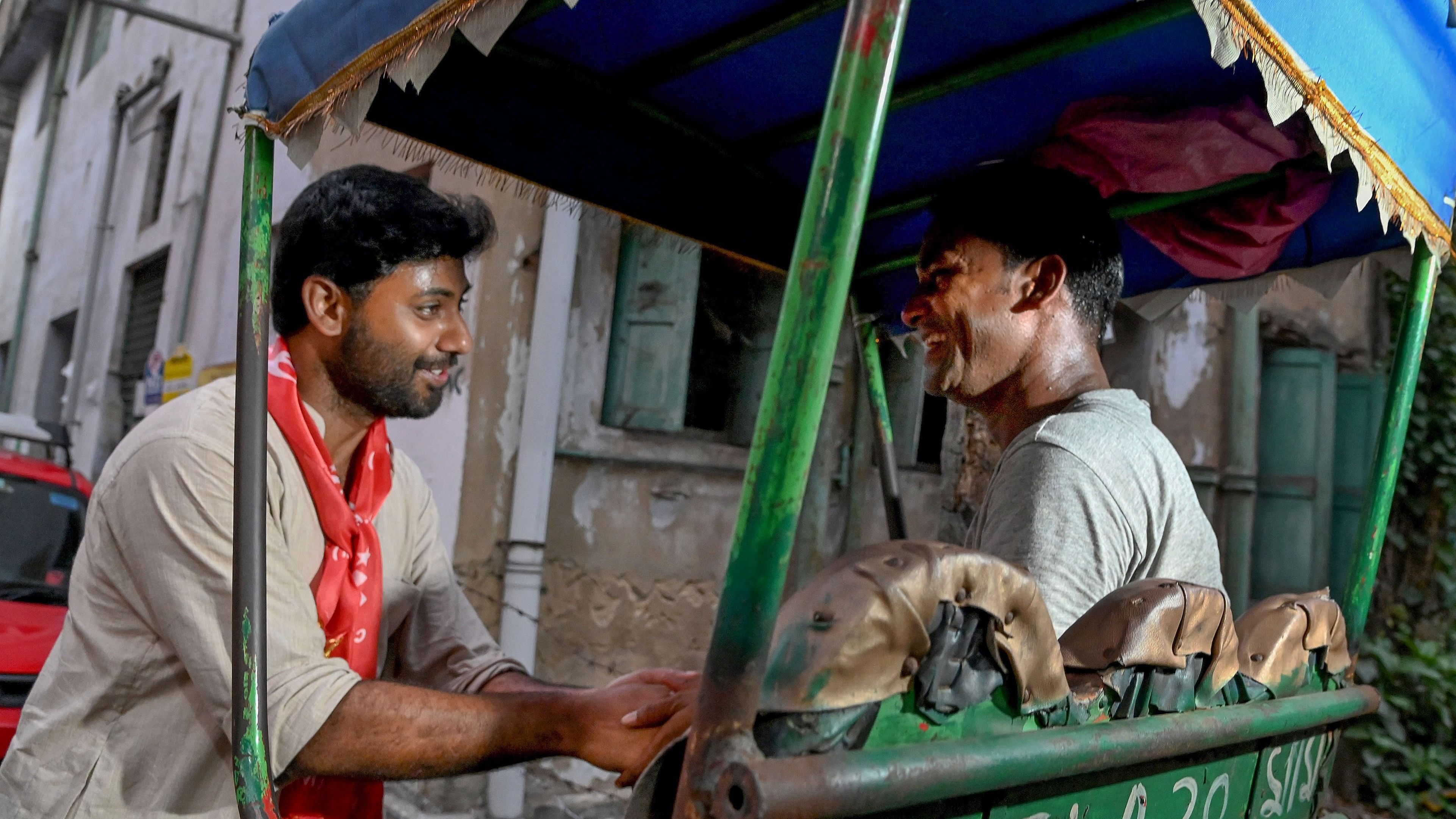 <div class="paragraphs"><p>CPI(M) candidate Srijan Bhattacharyya interacts with a rickshaw driver as he campaigns for the Lok Sabha elections, in Kolkata.</p></div>