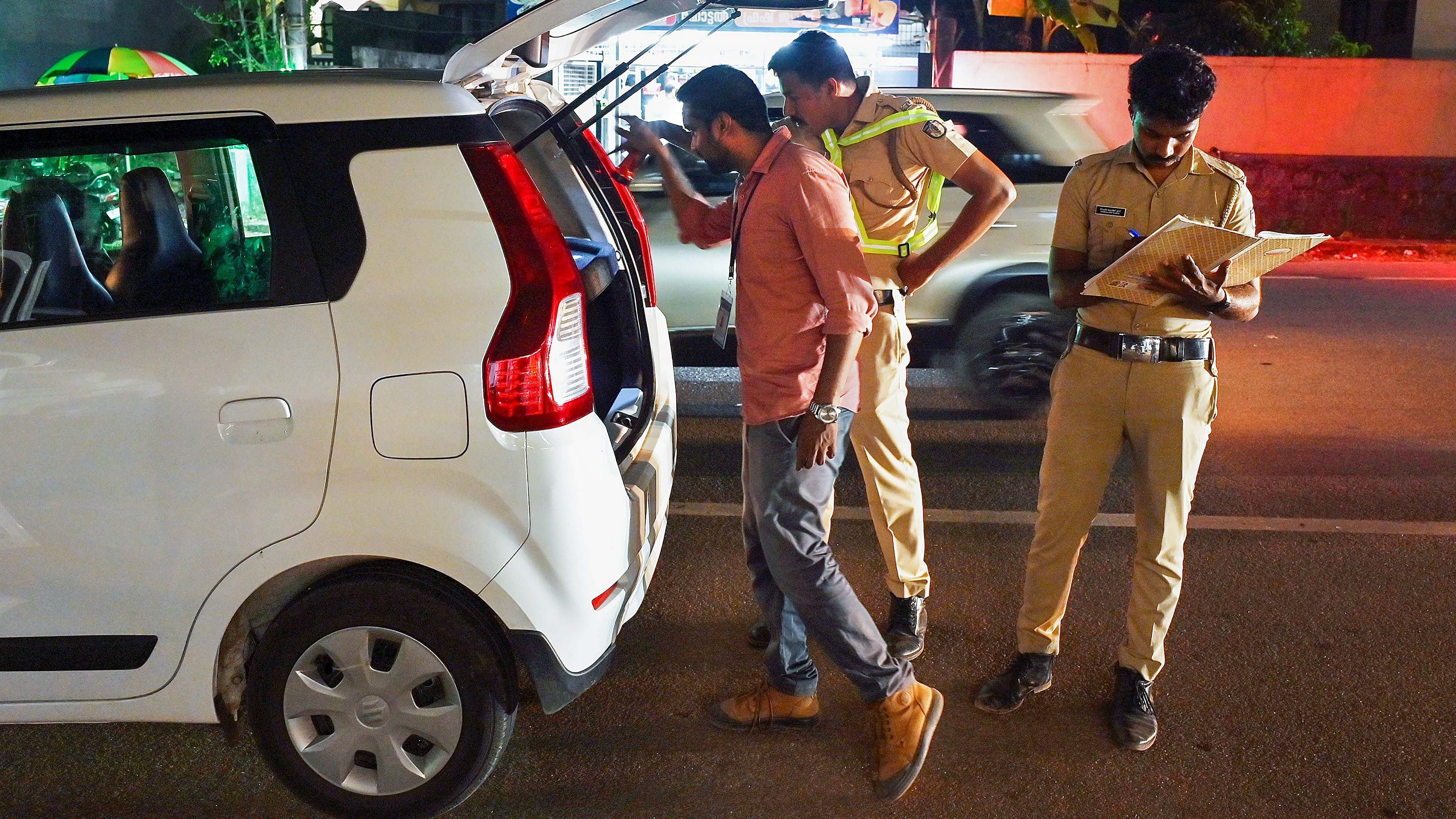 <div class="paragraphs"><p>Police personnel check a vehicle ahead of Lok Sabha elections.</p></div>