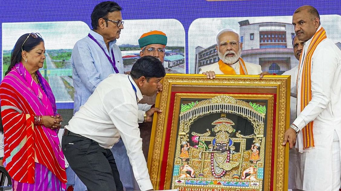 <div class="paragraphs"><p>Prime Minister Narendra Modi being presented a memento during an event</p></div>