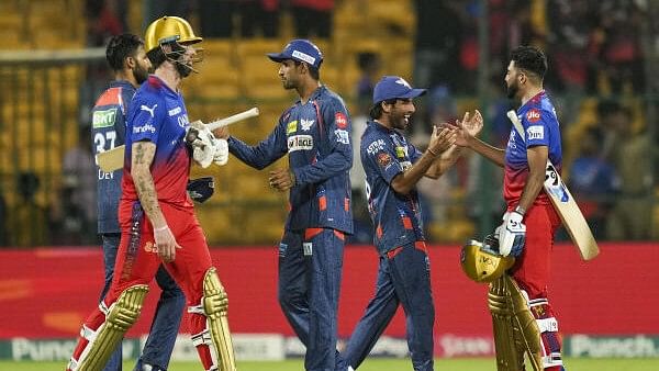 <div class="paragraphs"><p>Lucknow Super Giants' players being congratulated by Royal Challengers Bengaluru’s Reece Topley and Mohammed Siraj after winning the Indian Premier League (IPL) 2024 T20 cricket match between Royal Challengers Bengaluru and Lucknow Super Giants, at M Chinnaswamy Stadium, in Bengaluru, Tuesday, April 2, 2024.</p></div>