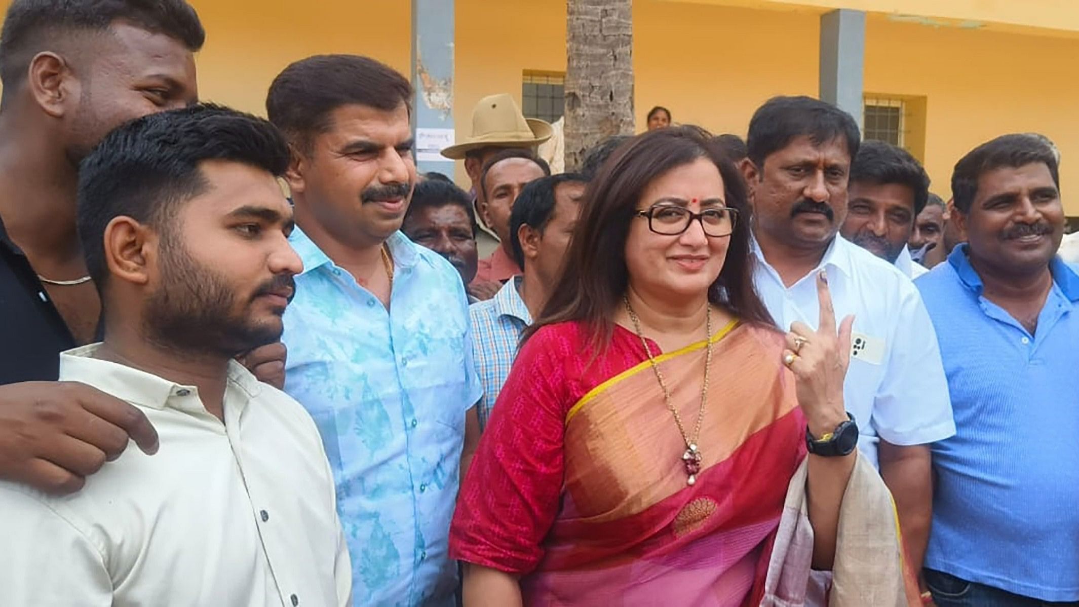 <div class="paragraphs"><p>Incumbent Lok Sabha member from Mandya Sumalatha Ambarish leaves the polling station after casting her vote at Doddarasinakere village in Maddur taluk of Mandya district on Friday. </p></div>