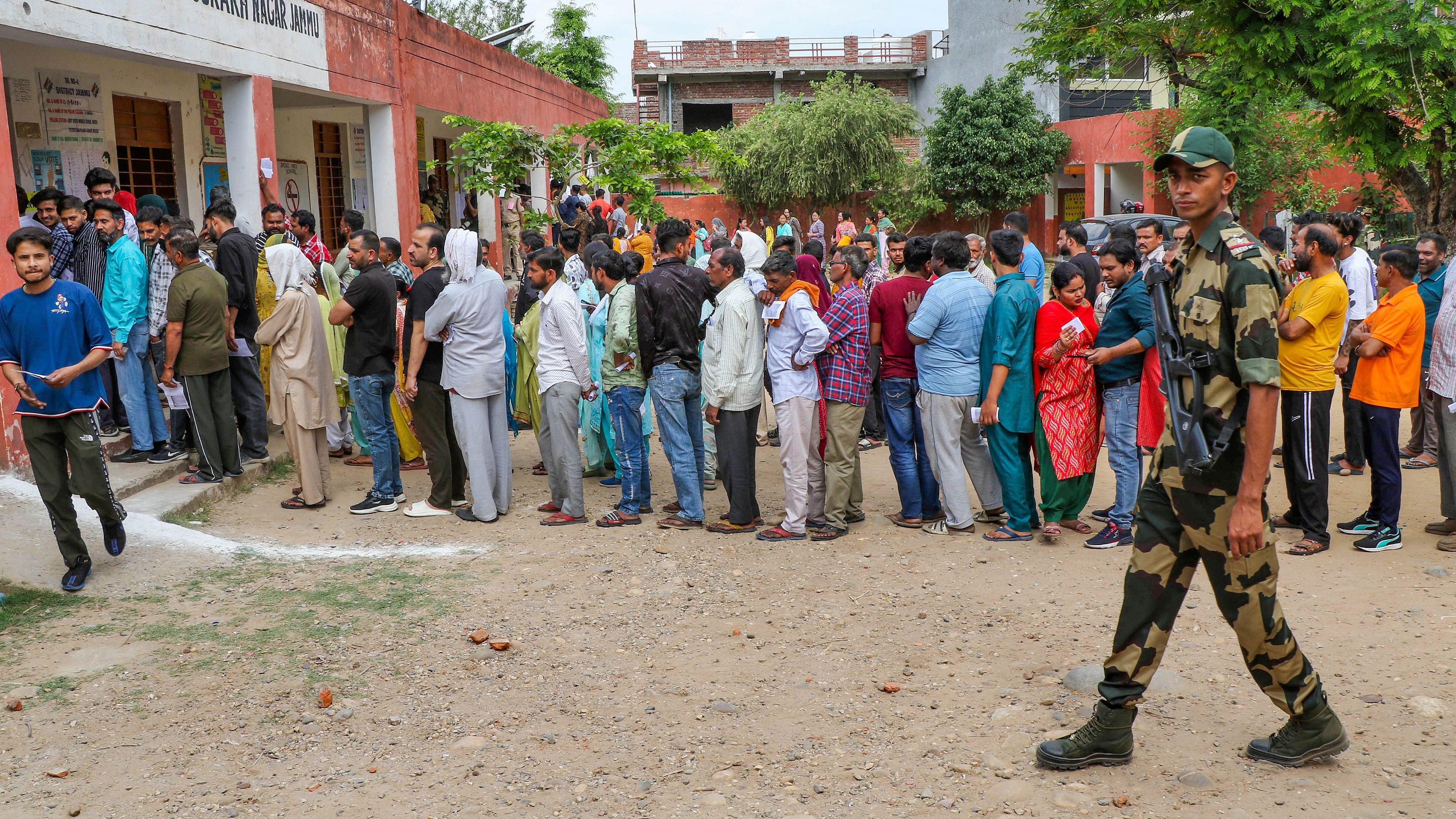 <div class="paragraphs"><p>Voters wait in a queue at a polling station to cast their votes for the 2nd phase of Lok Sabha elections, in Jammu, on Friday.</p></div>