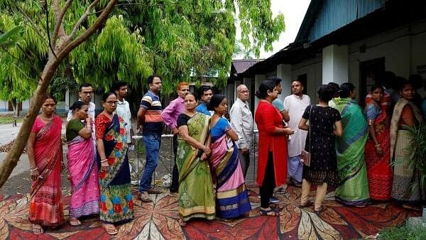 <div class="paragraphs"><p>People wait in line to cast their votes at a polling station during the first phase of the general election, in Alipurduar district in the eastern state of West Bengal, India, April 19, 2024.</p></div>