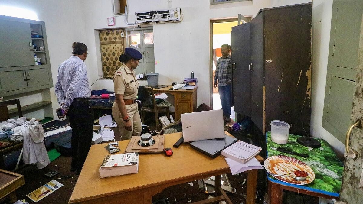 <div class="paragraphs"><p>In this file image, police investigate the Gujarat University hostel campus where students hailing from different foreign countries were assaulted over the issue of offering namaz.</p></div>
