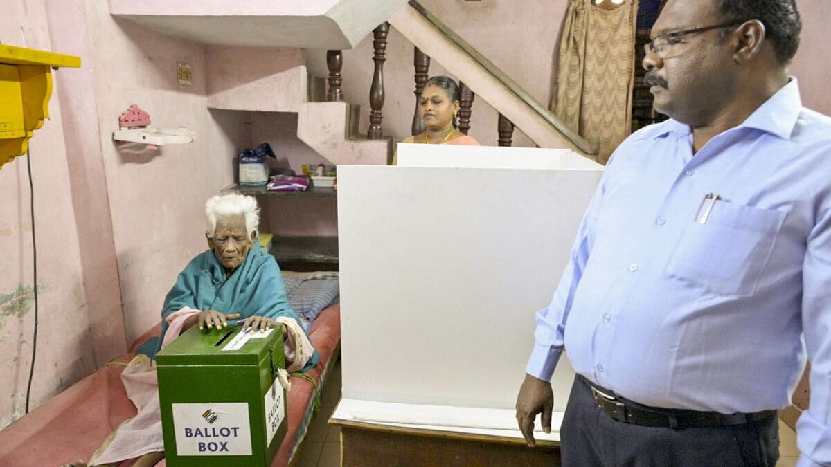 <div class="paragraphs"><p>An elderly voter casts his vote for the Lok Sabha election from his home through postal ballot using the ‘home-voting’ facility, in Puducherry.&nbsp;</p></div>