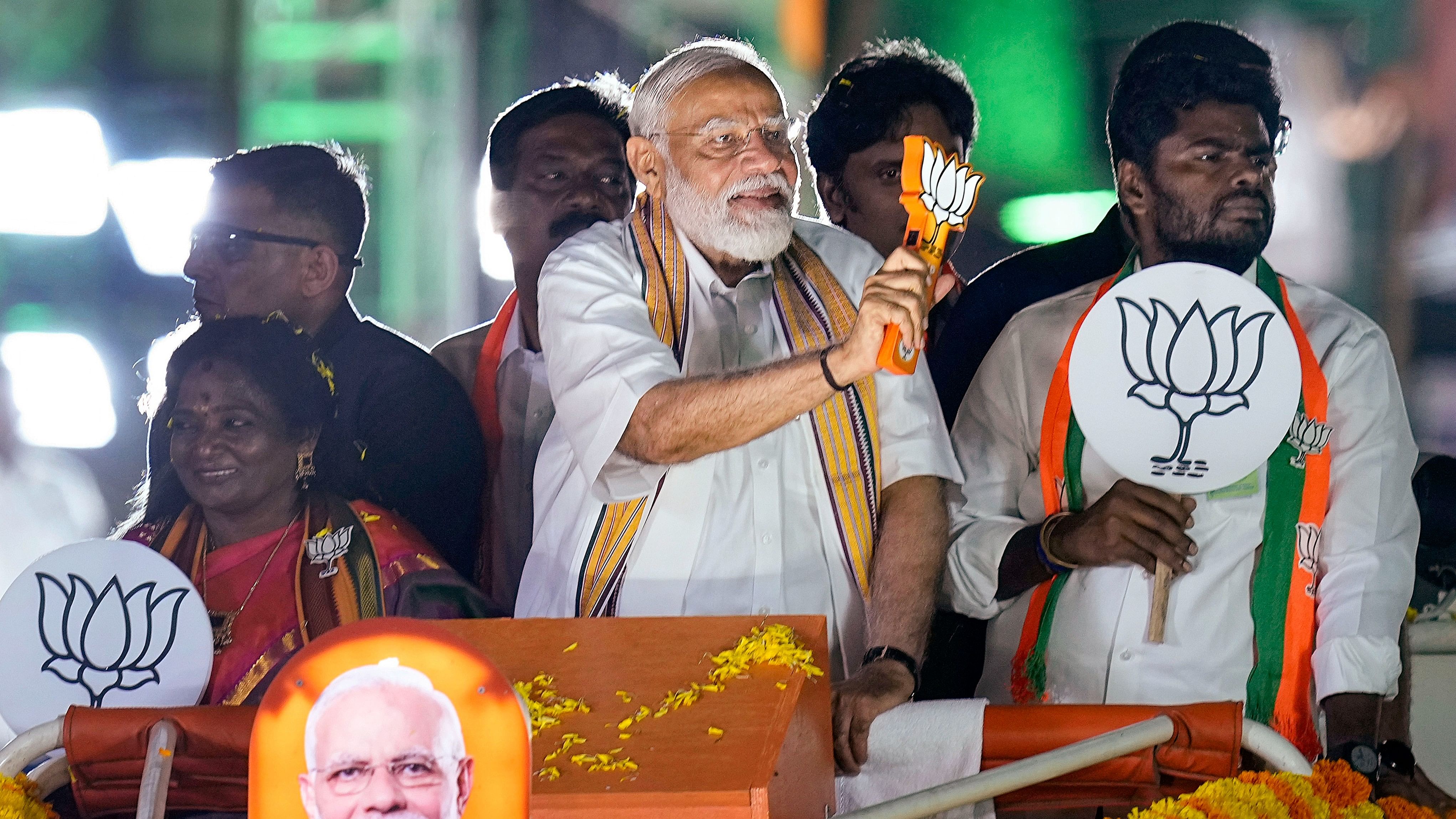 <div class="paragraphs"><p>Prime Minister Narendra Modi greets supporters during a roadshow in support of BJP's candidate from South Chennai constituency Tamilisai Soundararajan, ahead of the Lok Sabha elections, in Chennai.</p></div>
