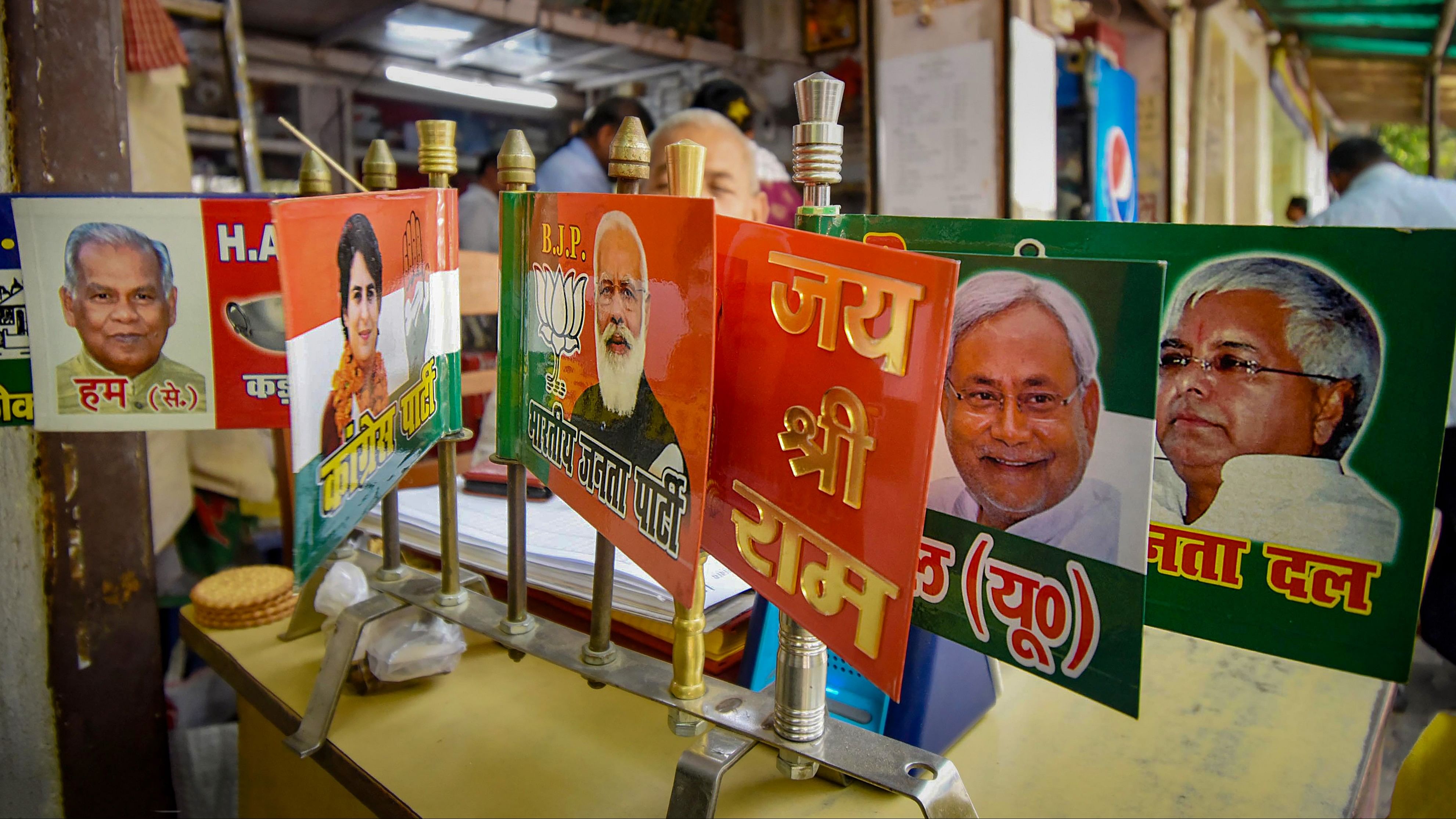 <div class="paragraphs"><p>Merchandise of different political parties are displayed for sale at a shop ahead of the upcoming Lok Sabha election, in Patna, Wednesday, April 3, 2024.</p></div>