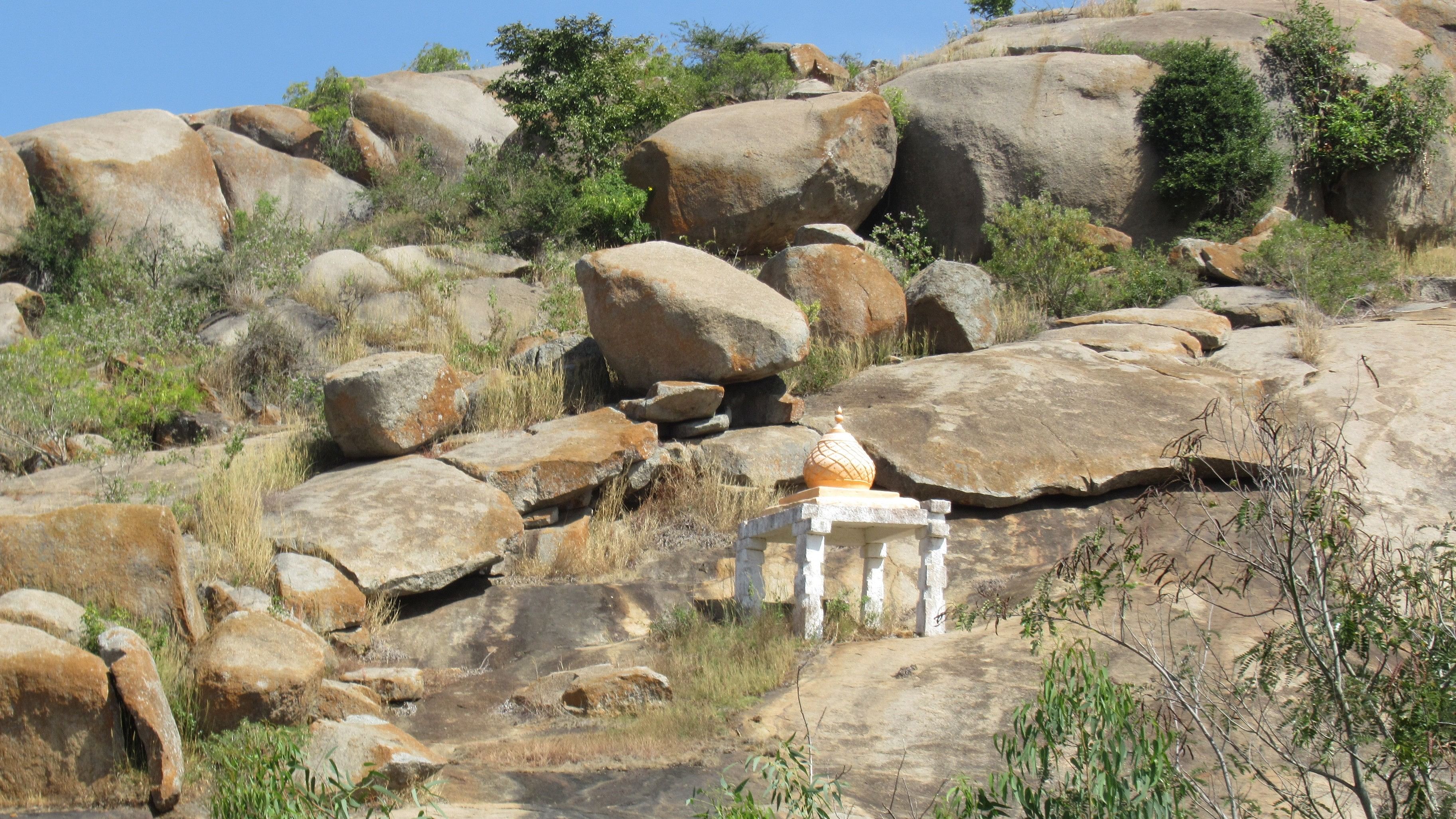 <div class="paragraphs"><p>Two inscriptions on the rock near the mantapa; (top) the hero stone at Shivagange hill. </p></div>