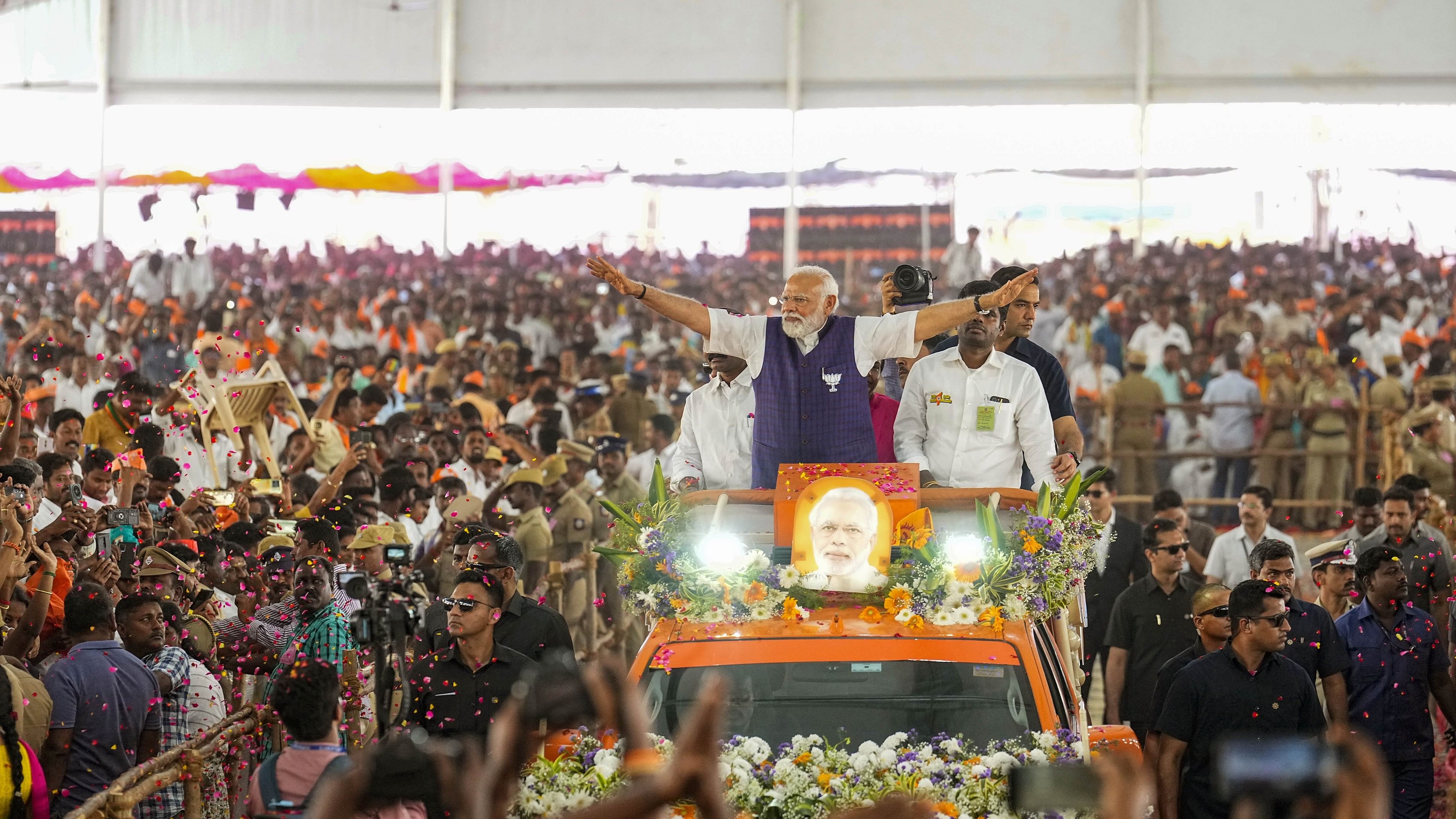 <div class="paragraphs"><p>Prime Minister Narendra Modi waves at supporters as he arrives for a public meeting ahead of Lok Sabha elections, in Salem, Tamil Nadu.</p></div>