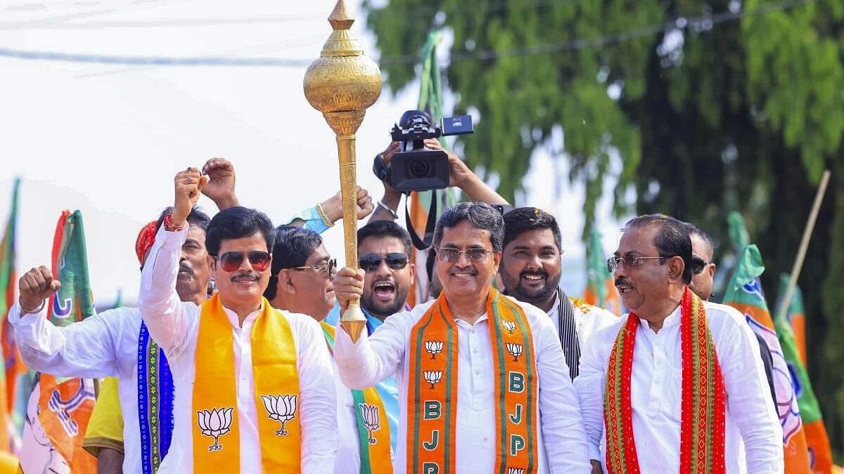 <div class="paragraphs"><p>CM Manik Saha and state BJP President Rajib Bhattacharjee (extreme right) at a BJP road show in Tripura.&nbsp;</p></div>