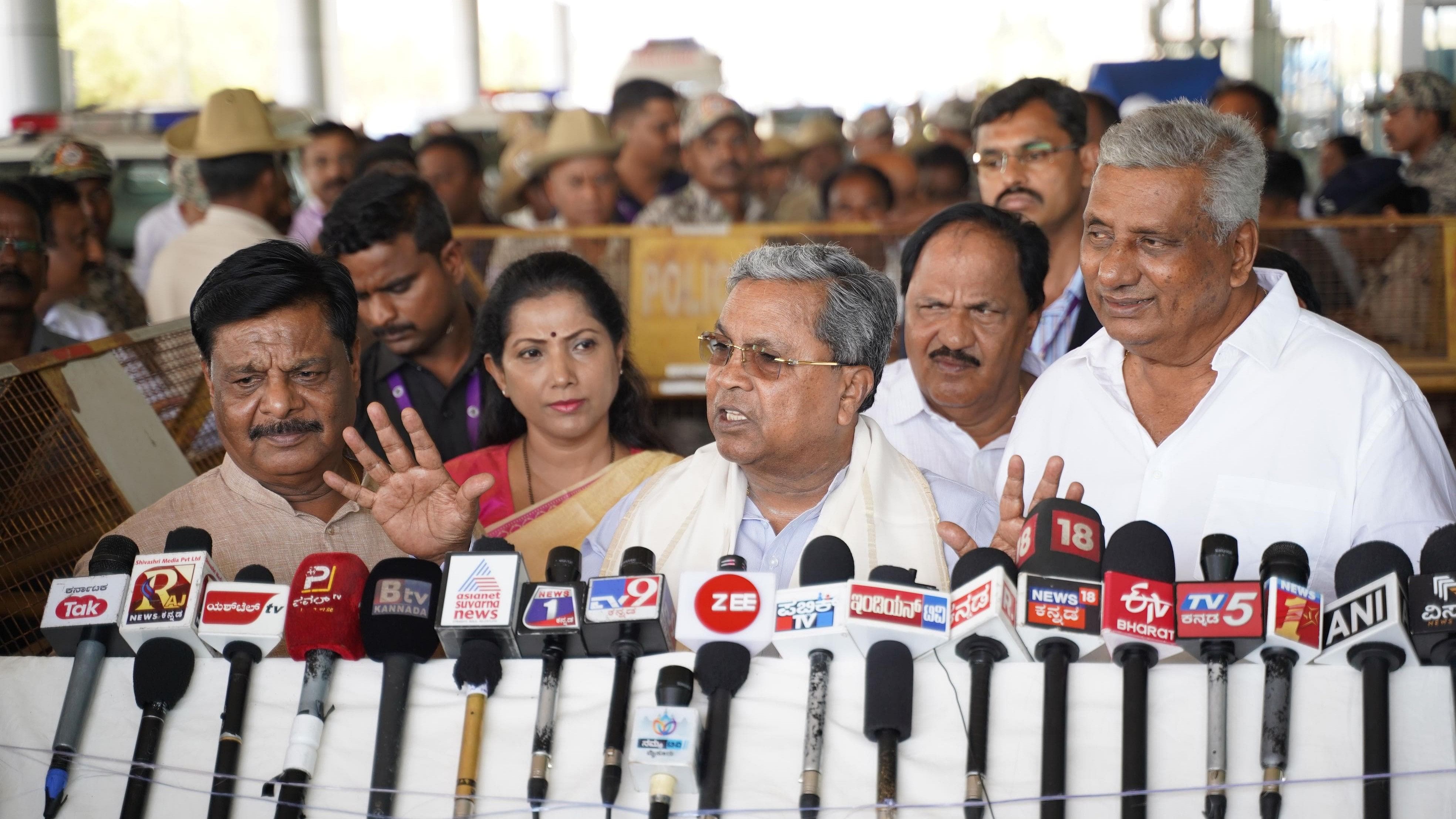 <div class="paragraphs"><p>Chief Minister Siddaramaiah speaks to media persons at Mysuru Airport, in Mysuru, on Monday. Ministers H C Mahadevappa and K Venkatesh, KPCC women’s wing president Pushpa Amarnath and MUDA Chairman K Marigowda are seen.<strong> </strong></p></div>