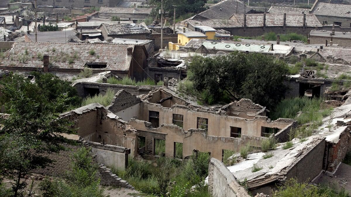 <div class="paragraphs"><p>Abandoned houses are seen in an area where land is sinking near a coal mine in Kouquan township of Datong, China's Shanxi province</p></div>