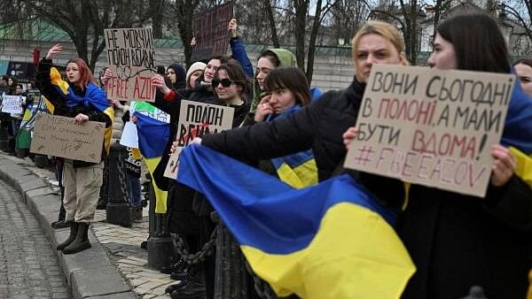 <div class="paragraphs"><p>Relatives of Ukrainian prisoners of war hold banners as they attend a rally calling for authorities to return their relatives from Russian captivity</p></div>