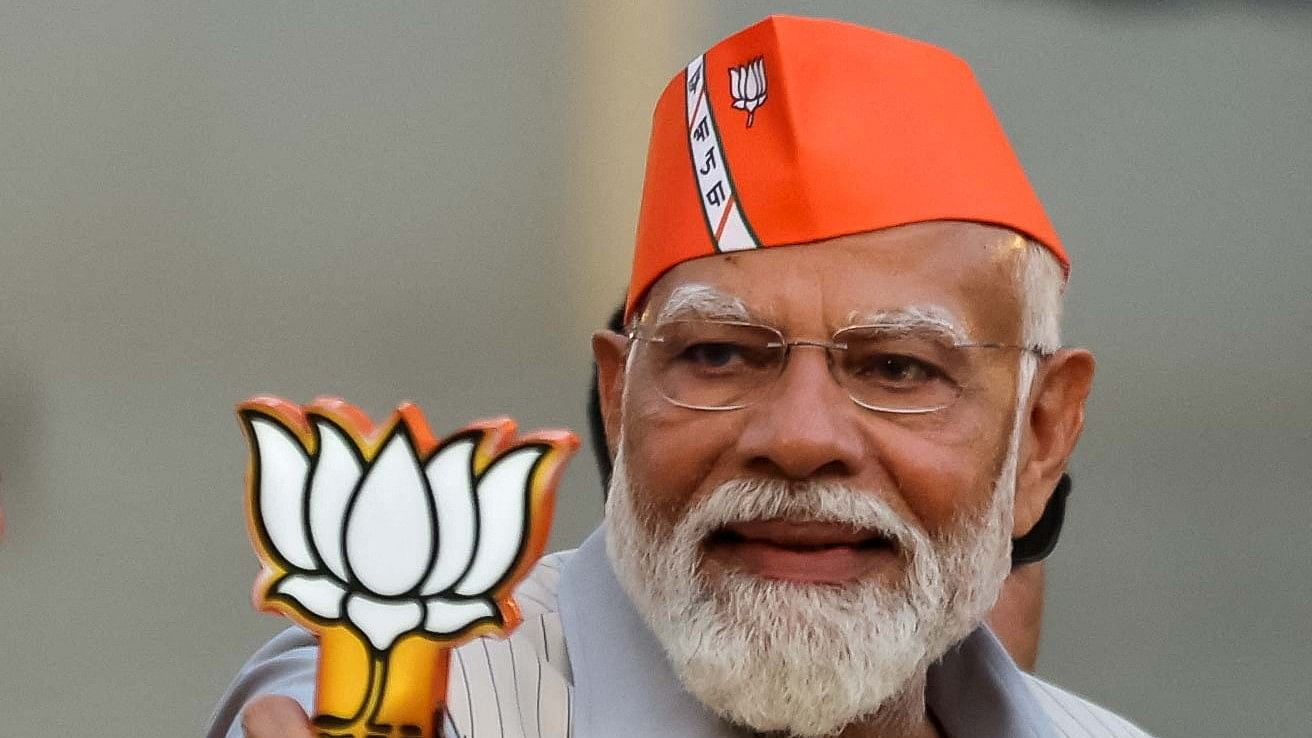 <div class="paragraphs"><p>Prime Minister Narendra Modi greets supporters during his roadshow, ahead of the general elections.</p></div>