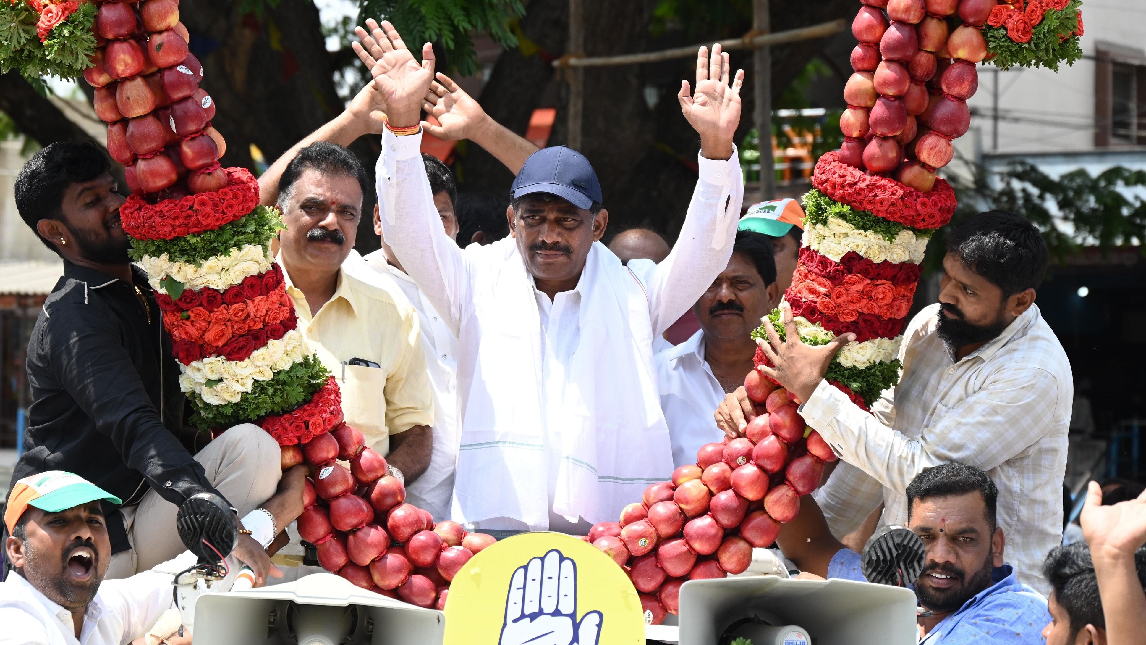 <div class="paragraphs"><p>D K Suresh, adorned with a striking garland of a hundred apples, launches his vibrant election campaign at Bannerghatta Circle. </p></div>
