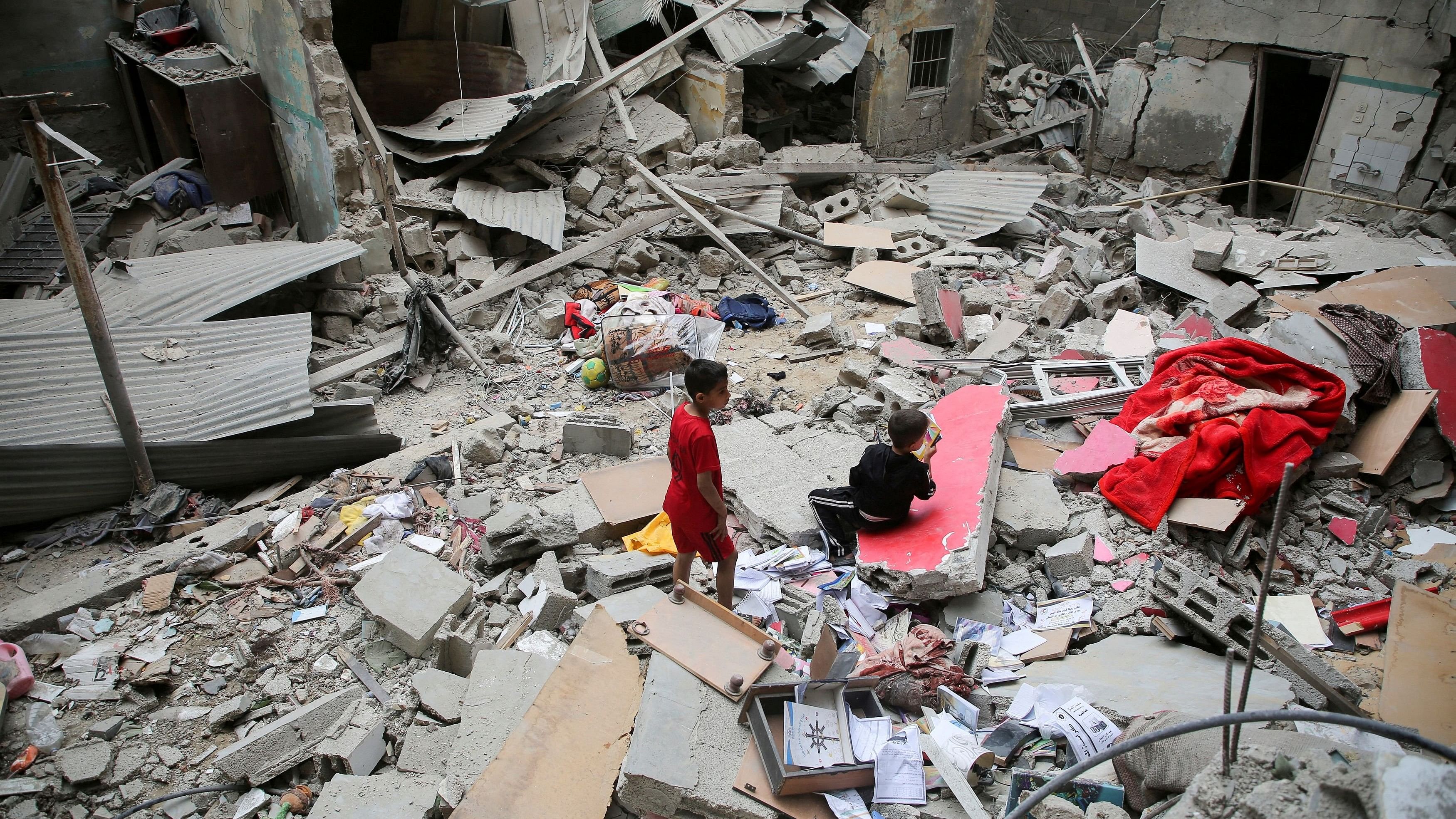 <div class="paragraphs"><p>FILE PHOTO: Palestinian children inspect the site of an Israeli strike on a house, amid the ongoing conflict between Israel and the Palestinian Islamist group Hamas, in Rafah, in the southern Gaza Strip, April 27, 2024. </p></div>