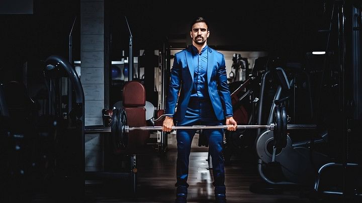 <div class="paragraphs"><p>Representative image of a man working out in a suit.</p></div>