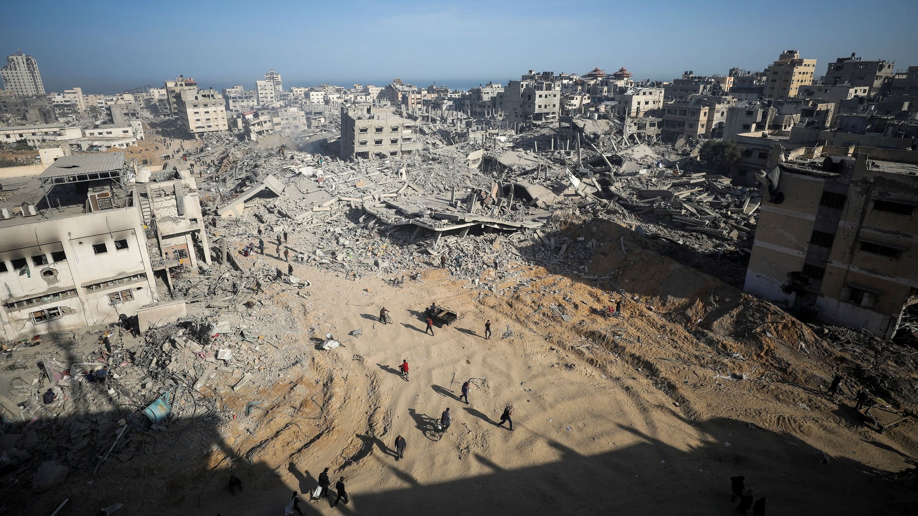 <div class="paragraphs"><p>Palestinians inspect damages after Israeli forces withdrew from Gaza's Al Shifa Hospital following a two-week operation in Gaza City on April 1, 2024. </p></div>