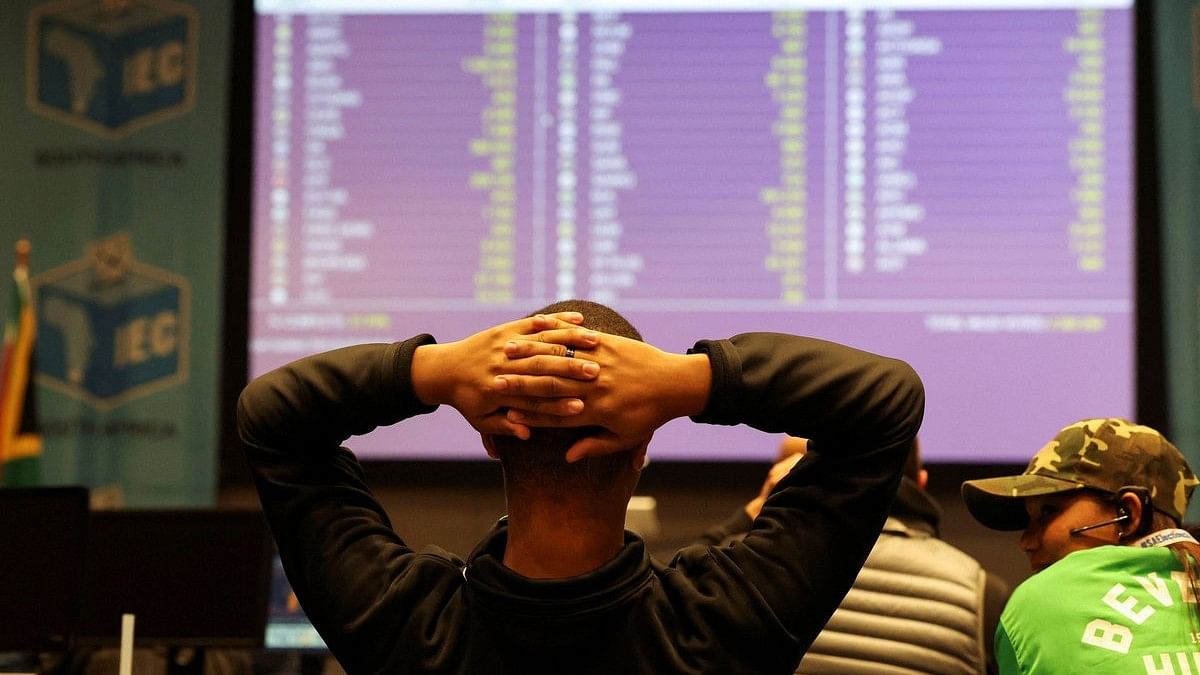 <div class="paragraphs"><p>A member of the Patriotic Alliance political party looks at an electronic board where results of the South African national election are displayed at the Western Cape Independent Electoral Commission Results Operating Centre, in Cape Town, South Africa, May 30, 2024. </p></div>