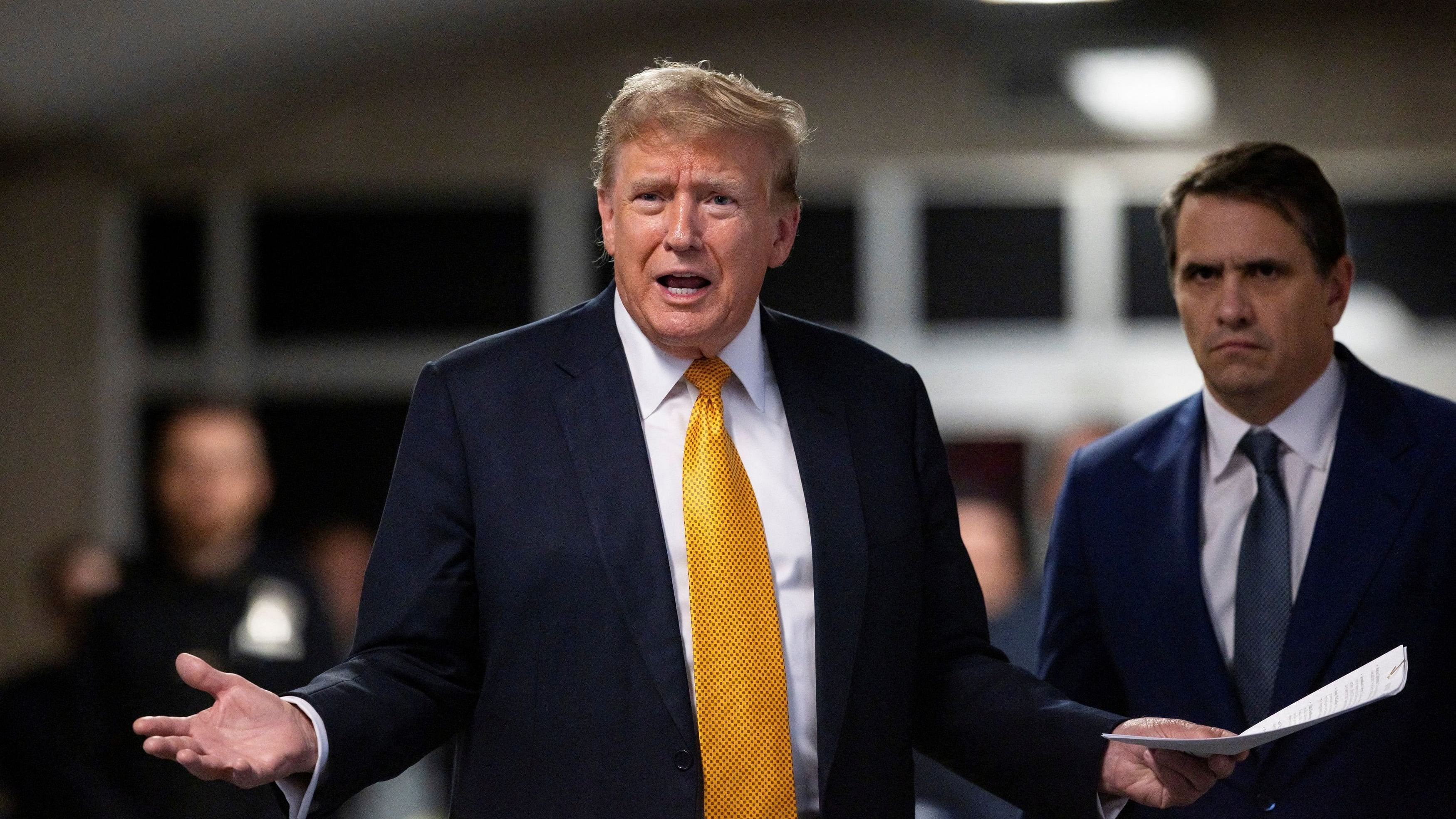 <div class="paragraphs"><p>Former US President Donald Trump talks to the press while standing with his attorney Todd Blanche at the end of the day at his criminal trial at New York State Supreme Court in New York City.</p></div>