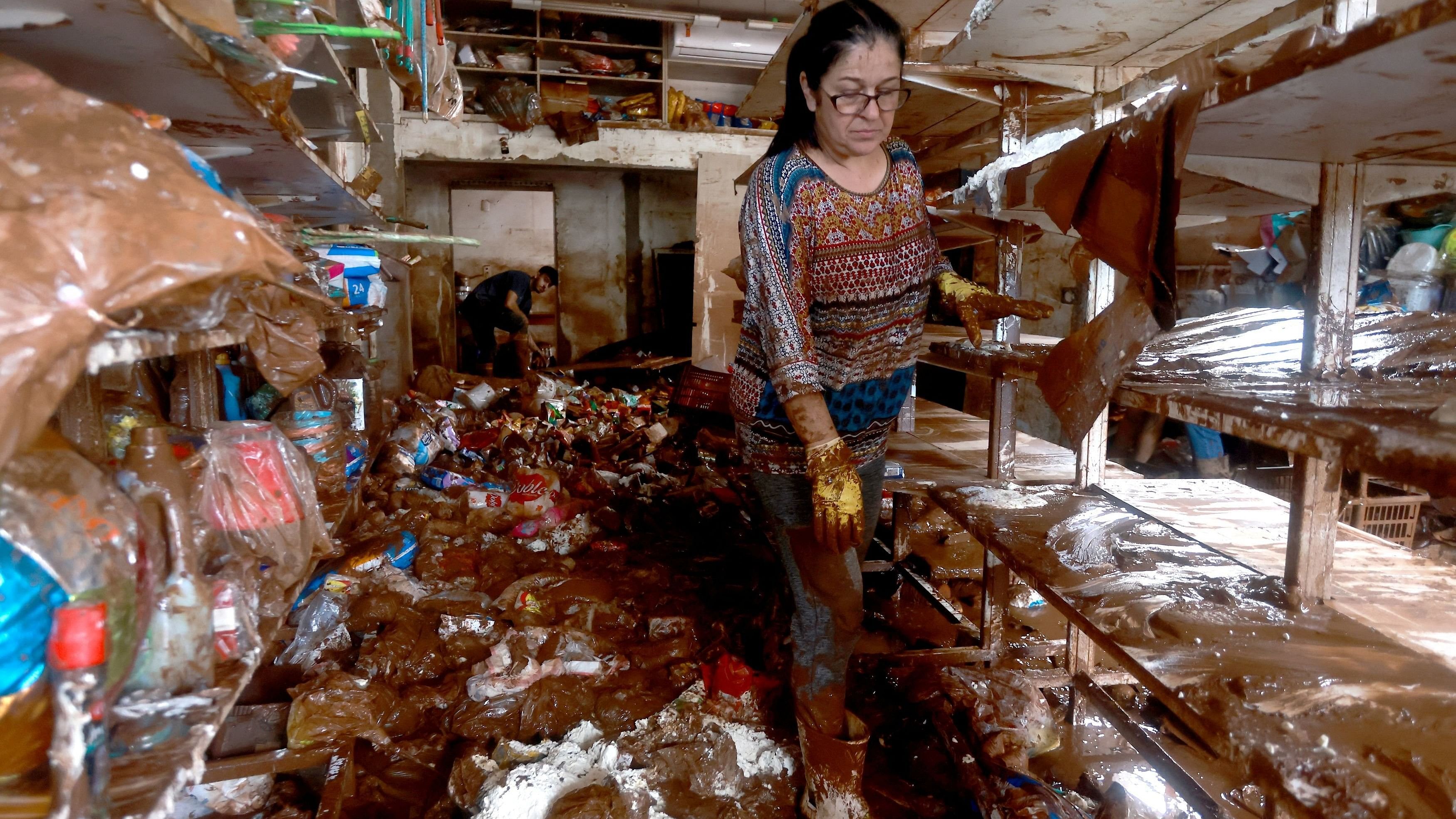 <div class="paragraphs"><p>People walk inside a shop destroyed by the currents of the flash floods caused by heavy rains in Jacarezinho, Rio Grande do Sul state, Brazil.</p></div>