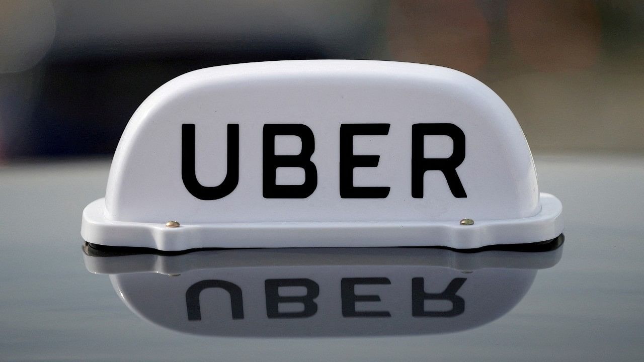 <div class="paragraphs"><p>Uber logo as seen on a car front. </p></div>