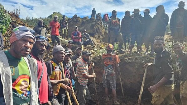 <div class="paragraphs"><p>A locals gather amid the damage after a landslide in Maip Mulitaka, Enga province, Papua New Guinea May 24, 2024 in this obtained image. </p></div>