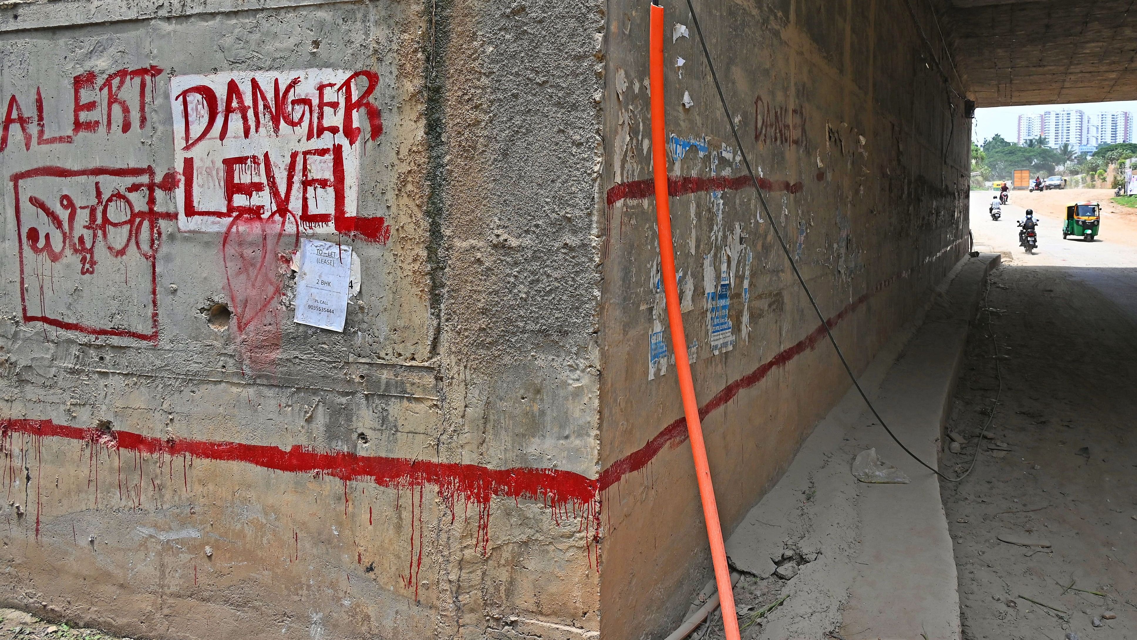 <div class="paragraphs"><p>Officials paint red signs on underpasses (like this one at Hosakerehalli Cross), warning motorists not to use them when water levels go beyond the marks.&nbsp;</p></div>