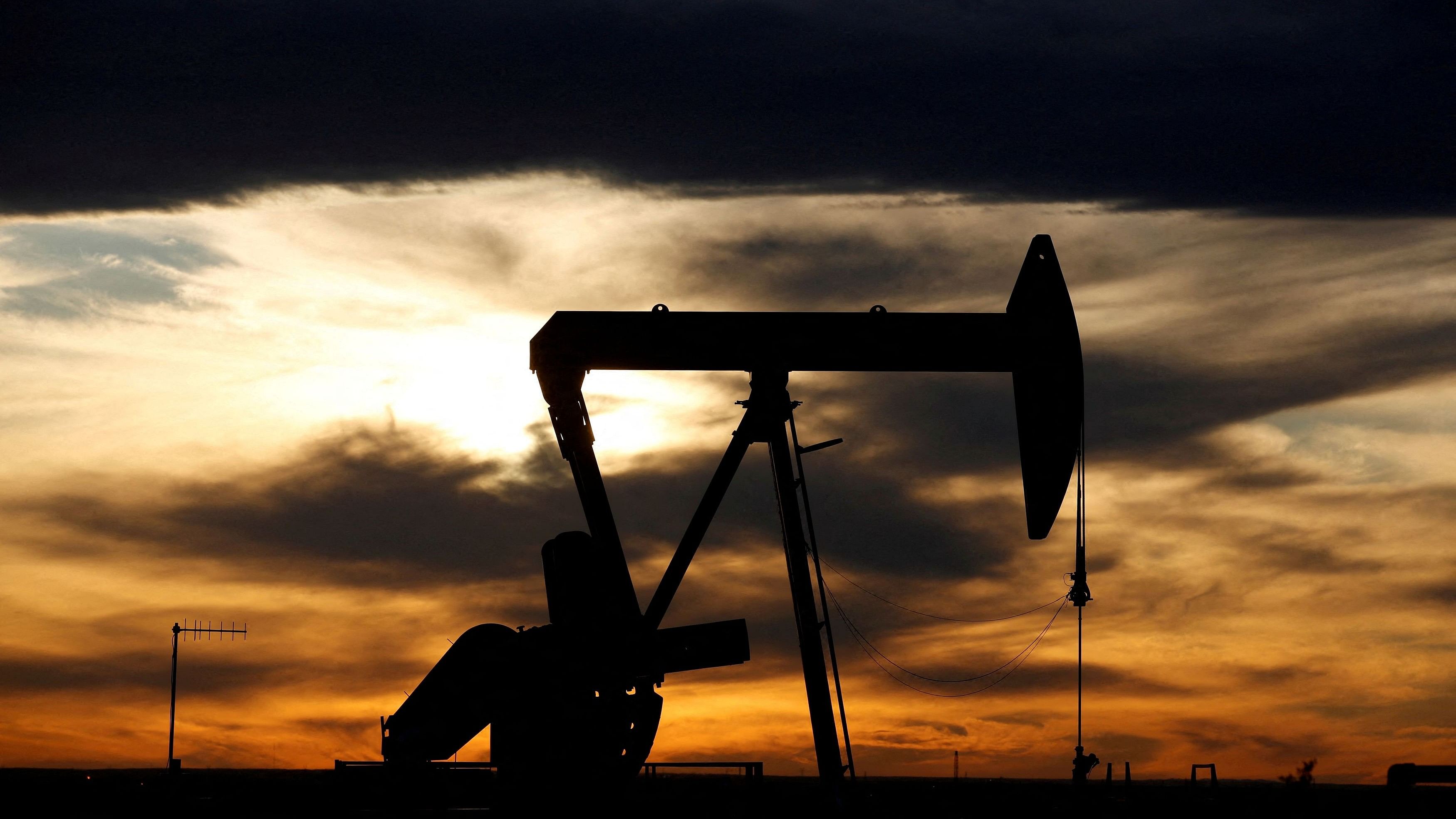 <div class="paragraphs"><p>The sun sets behind a crude oil pump jack on a drill pad in the Permian Basin in Texas.</p></div>