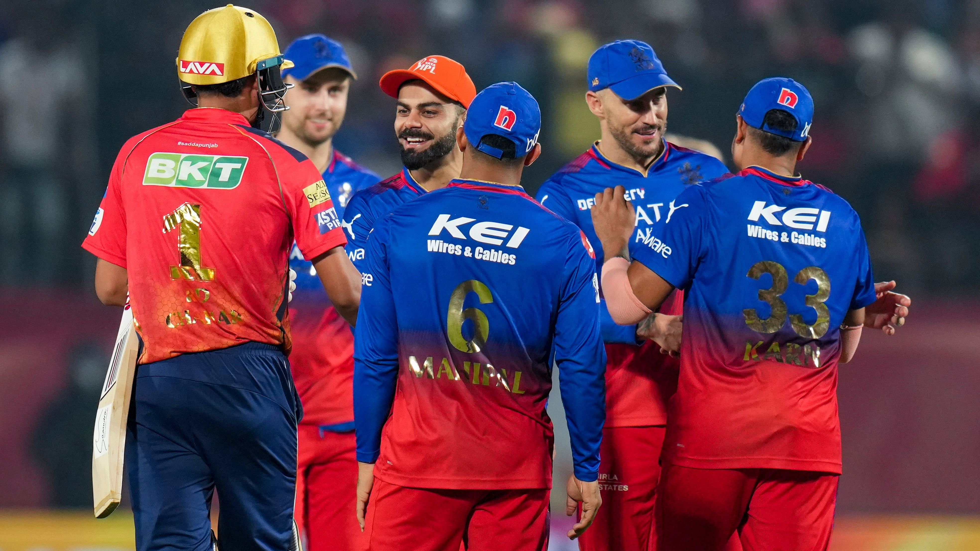 <div class="paragraphs"><p>Royal Challengers Bengaluru's captain Faf du Plessis and Virat Kohli celebrates with teammates after winning the Indian Premier League (IPL) 2024 T20 cricket match between Punjab Kings and Royal Challengers Bengaluru, at HPCA Stadium, in Dharamshala, Thursday, May 9, 2024. </p></div>