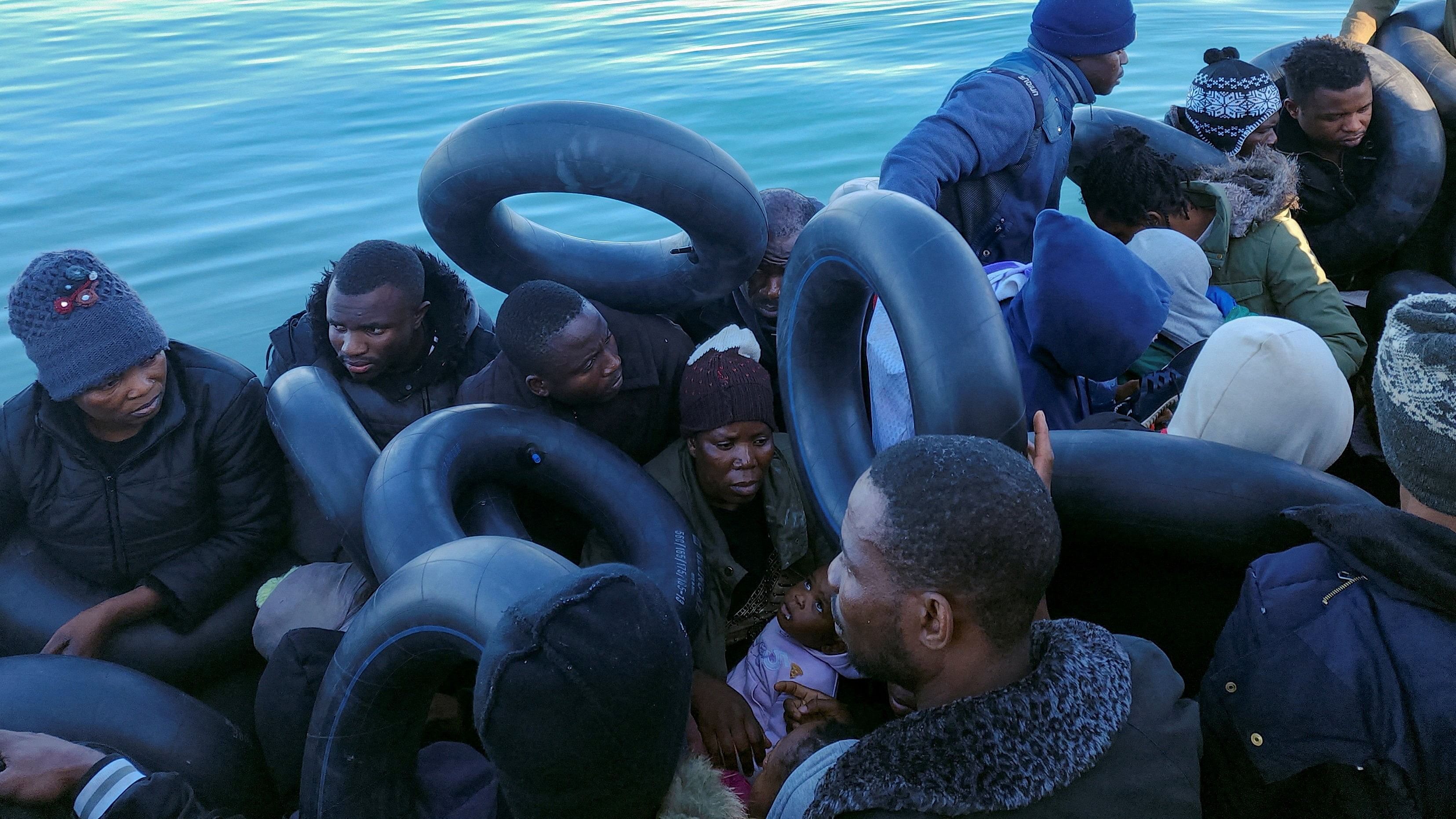 <div class="paragraphs"><p>Migrants are pictured on a boat as they are stopped by Tunisian coast guard at sea during their attempt to cross to Italy, off the coast of Sfax, Tunisia. Representative image.</p></div>