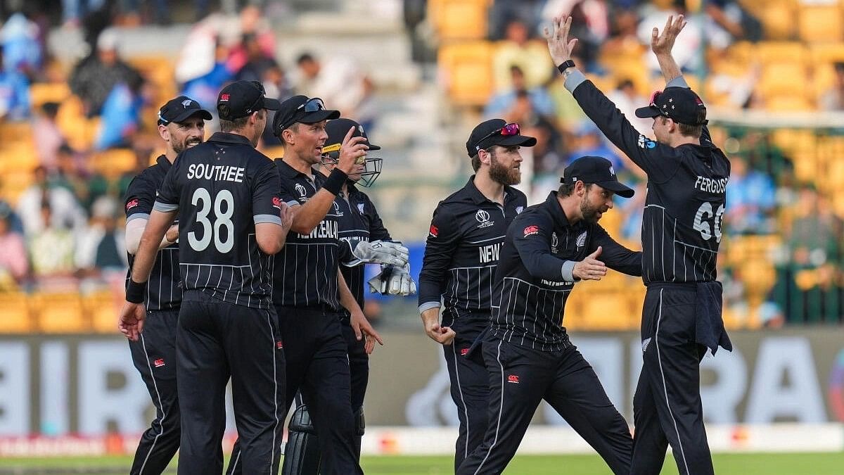 <div class="paragraphs"><p>Players of the New Zealand cricket team celebrate during a match.</p></div>