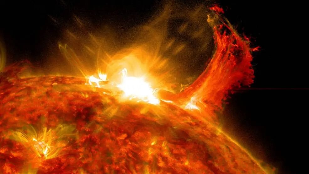 <div class="paragraphs"><p>The solar flare is the bright flash of light at top. A burst of solar material erupting out into space can be seen just to the right of it. Representative image.</p></div>