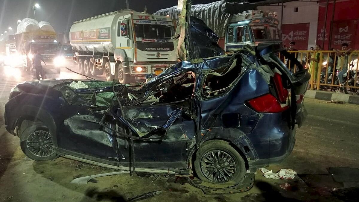 <div class="paragraphs"><p>Mangled remains of the car after it collided with a truck on National Highway-9 in Garhmukteshwar area, Hapur, May 14, 2024. Six persons were killed and one person was injured in the accident. </p></div>