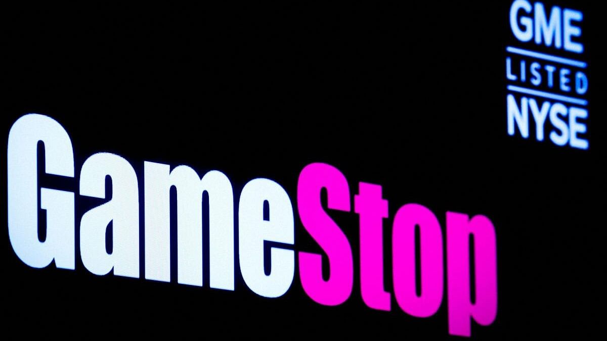 <div class="paragraphs"><p>A screen displays the logo and trading information for GameStop at the NYSE in New York.</p></div>