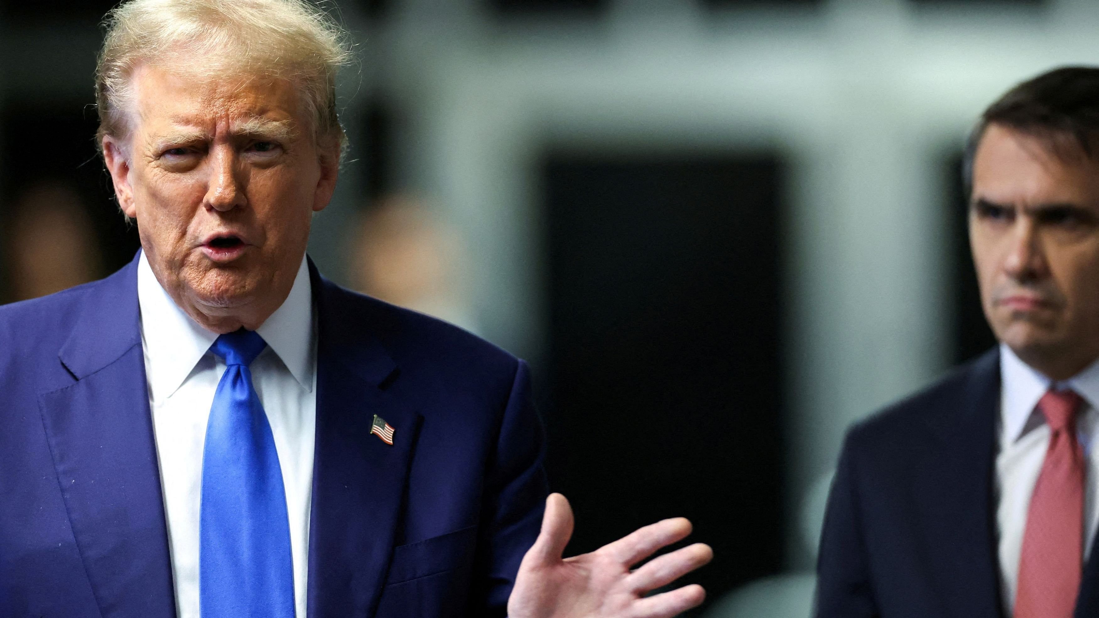 <div class="paragraphs"><p>Former US President Donald Trump, with his attorney Todd Blanche, speaks to the press as he arrives for his trial for allegedly covering up hush money payments linked to extramarital affairs.</p></div>