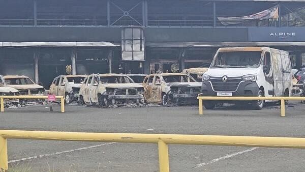 <div class="paragraphs"><p>A view of burnt cars at a showroom in Noumea, New Caledonia.</p></div>