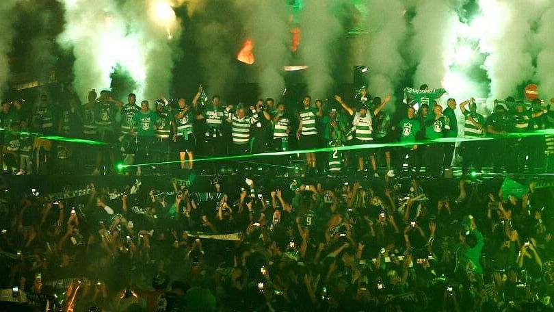 <div class="paragraphs"><p>Sporting CP team celebrates with their supporters after winning the Portuguese League, in Lisbon, Portugal</p></div>