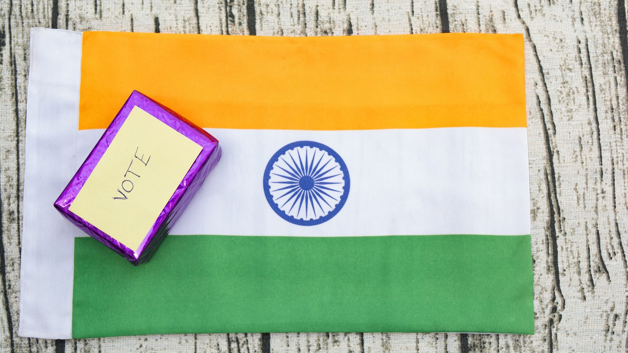 <div class="paragraphs"><p>Representative image showing the Indian flag and the word 'vote'.</p></div>