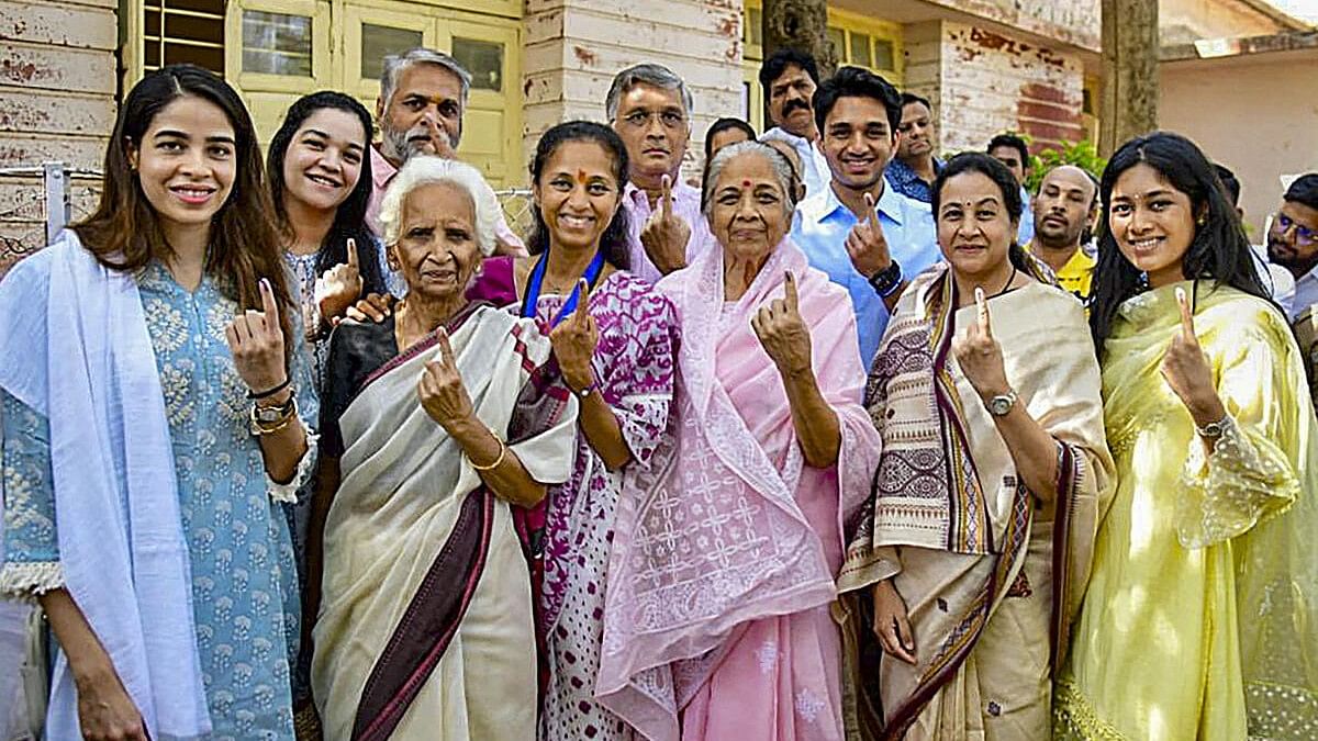 <div class="paragraphs"><p>Candidate of Baramati Lok Sabha Constituency of Mahavikas Aghadi Supriya Sule with her family shows ink-marked finger after casting vote for the third phase of Lok Sabha elections, in Baramati, Tuesday, May 7, 2024. </p></div>