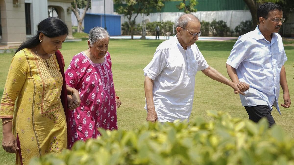 <div class="paragraphs"><p>Arvind Kejriwal with his family waits for a Delhi Police team in connection with AAP MP Swati Maliwal's alleged assault case, at his residence.&nbsp;</p></div>