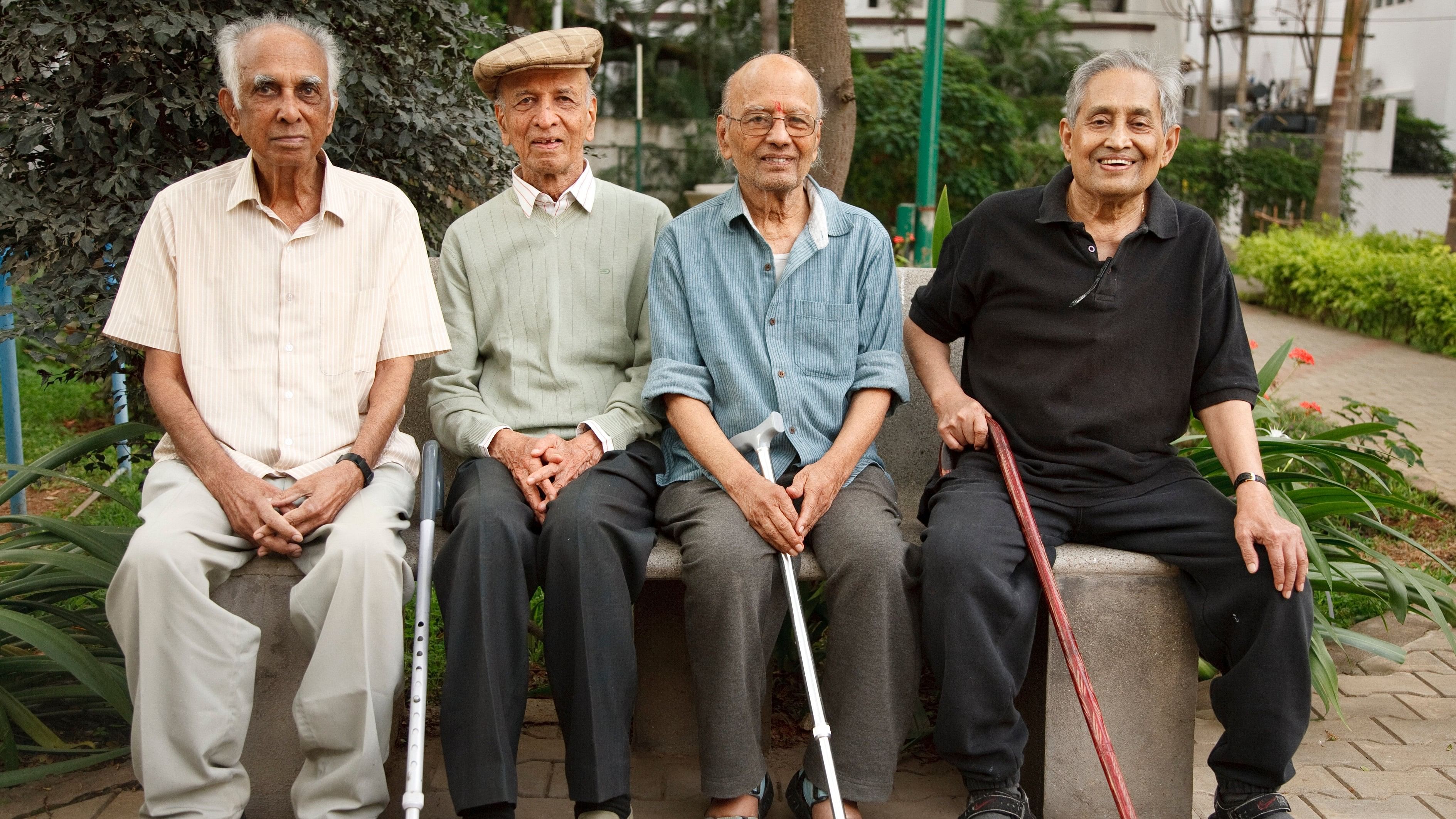 <div class="paragraphs"><p> Group of old Indian senior men relax on a park bench in Bangalore,.</p></div>