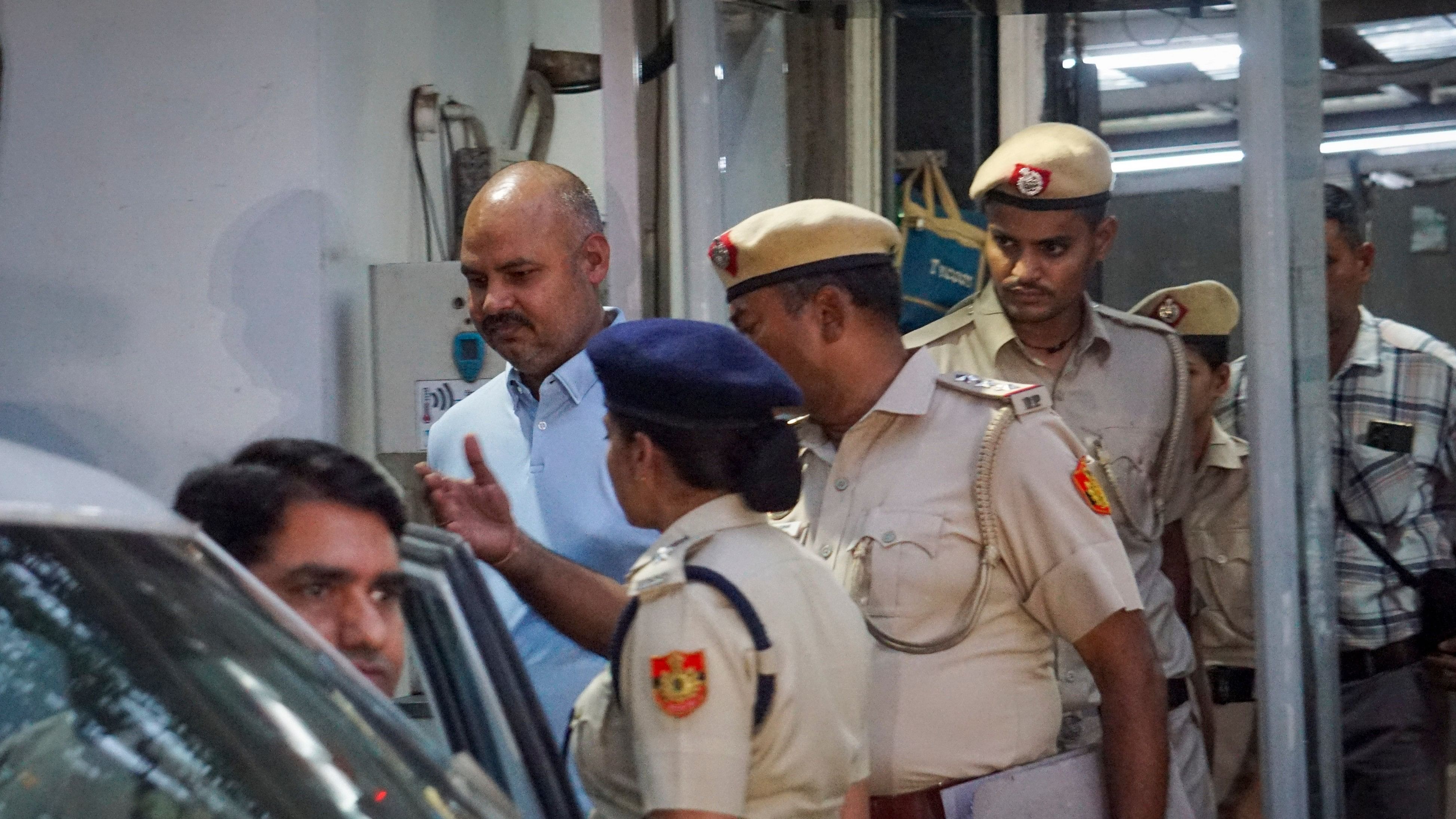 <div class="paragraphs"><p>Delhi Police personnel with Chief Minister Arvind Kejriwal'ss aide Bibhav Kumar come out of Kejriwal's residence after recreation of the scene in AAP MP Swati Maliwal's assault case, in New Delhi, Monday, May 20, 2024. </p></div>