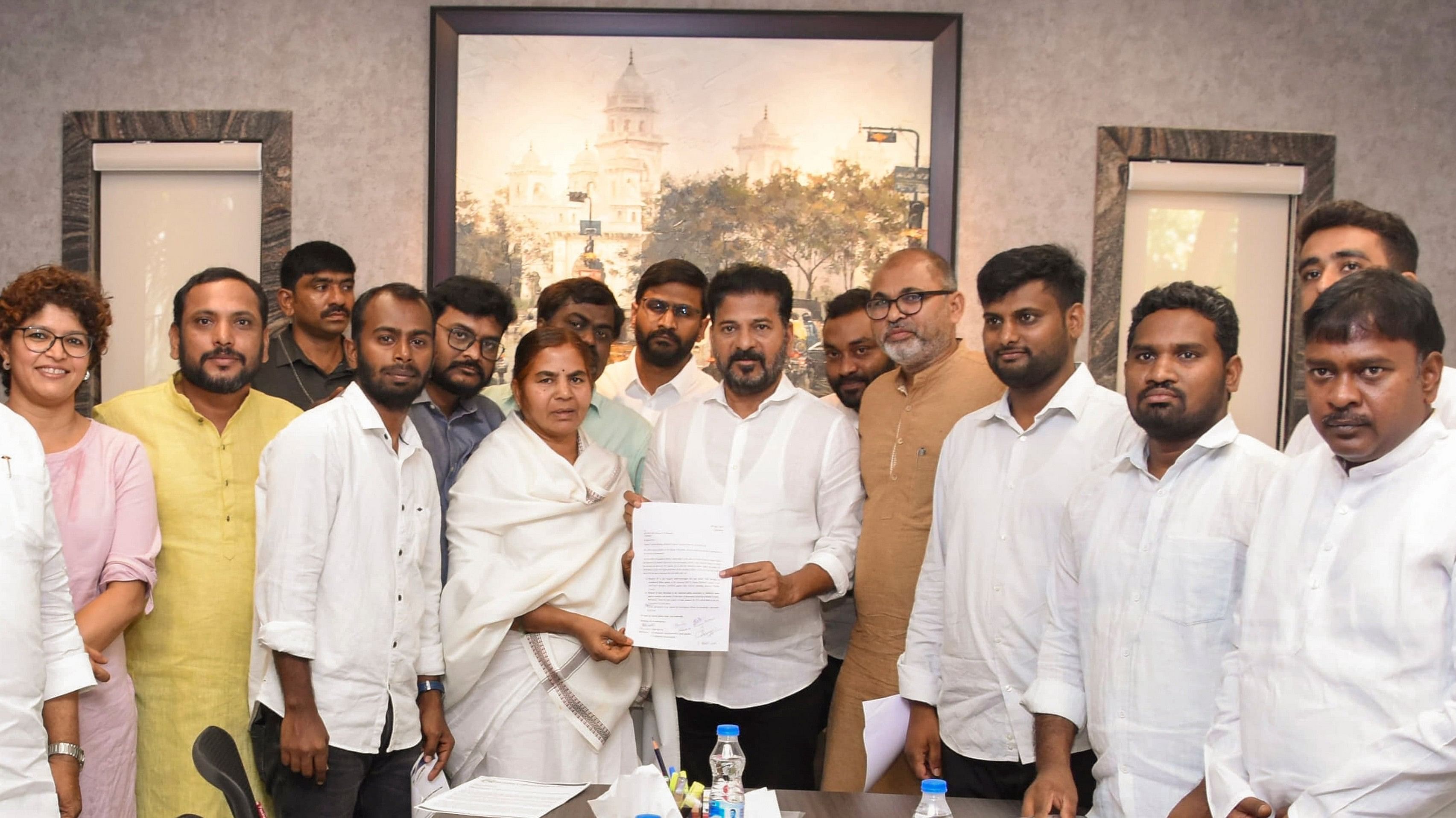 <div class="paragraphs"><p>Telangana Chief Minister Revanth Reddy with University of Hyderabad student Rohith Vemula's mother Radhika Vemula and brother Raja Vemula and others during a meeting, in Hyderabad, Saturday, May 4, 2024. </p></div>