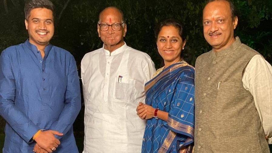 <div class="paragraphs"><p> Sharad Pawar with his daughter  Supriya Sule, his nephew Ajit Pawar and grandnephew Rohit Pawar.</p></div>