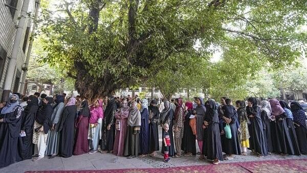 <div class="paragraphs"><p>Women voters queue up at a polling station to cast their votes in the sixth phase of Lok Sabha elections, Zafrabad, in New Delhi, Saturday, May 25, 2024.</p></div>