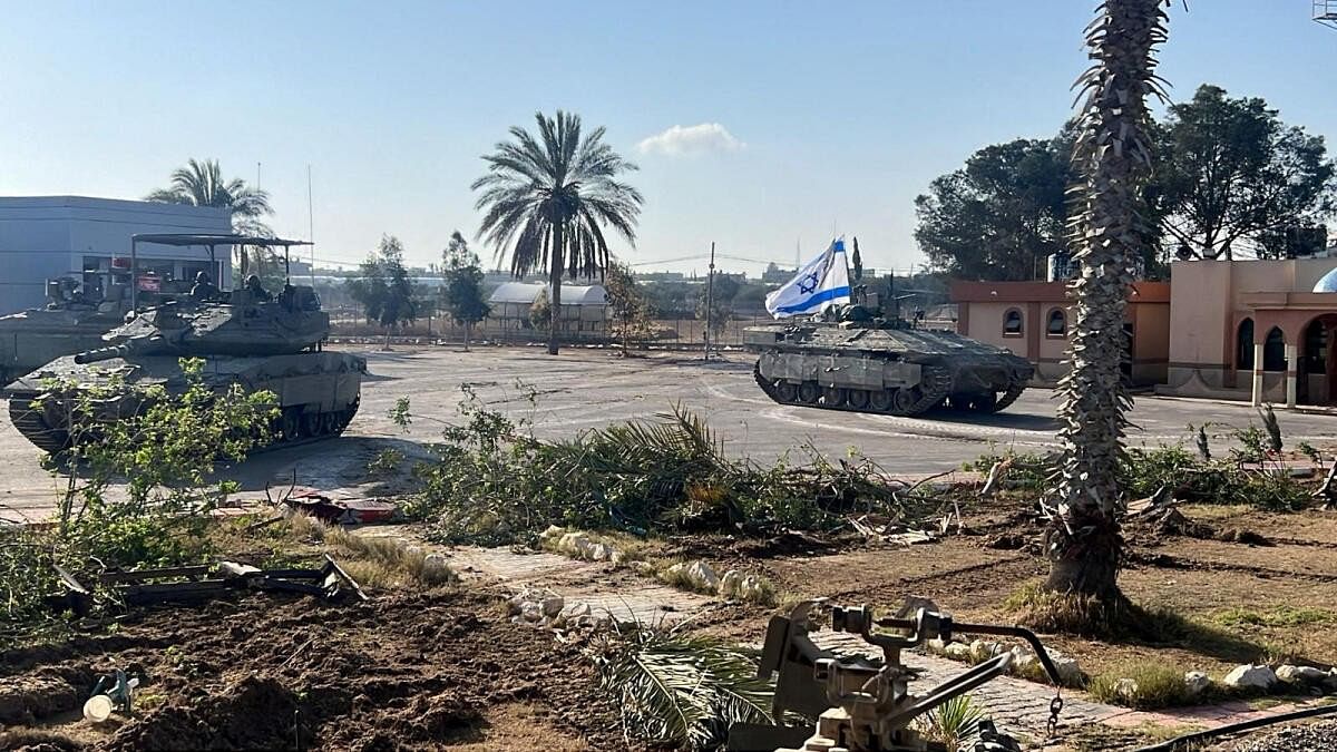 <div class="paragraphs"><p>Israeli military vehicles operate in the Gazan side of the Rafah Crossing, amid the ongoing conflict between Israel and Palestinian Islamist group Hamas, in the southern Gaza Strip.</p></div>